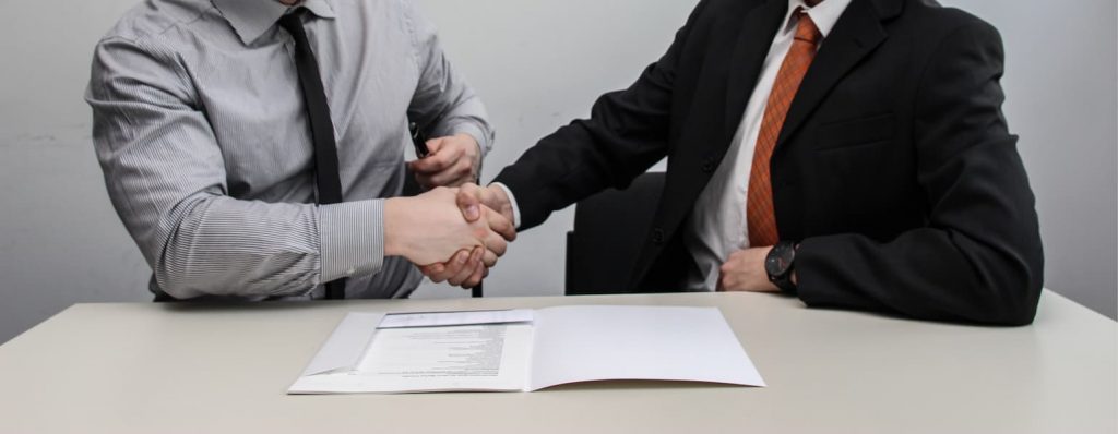 accountant and client are shaking hands