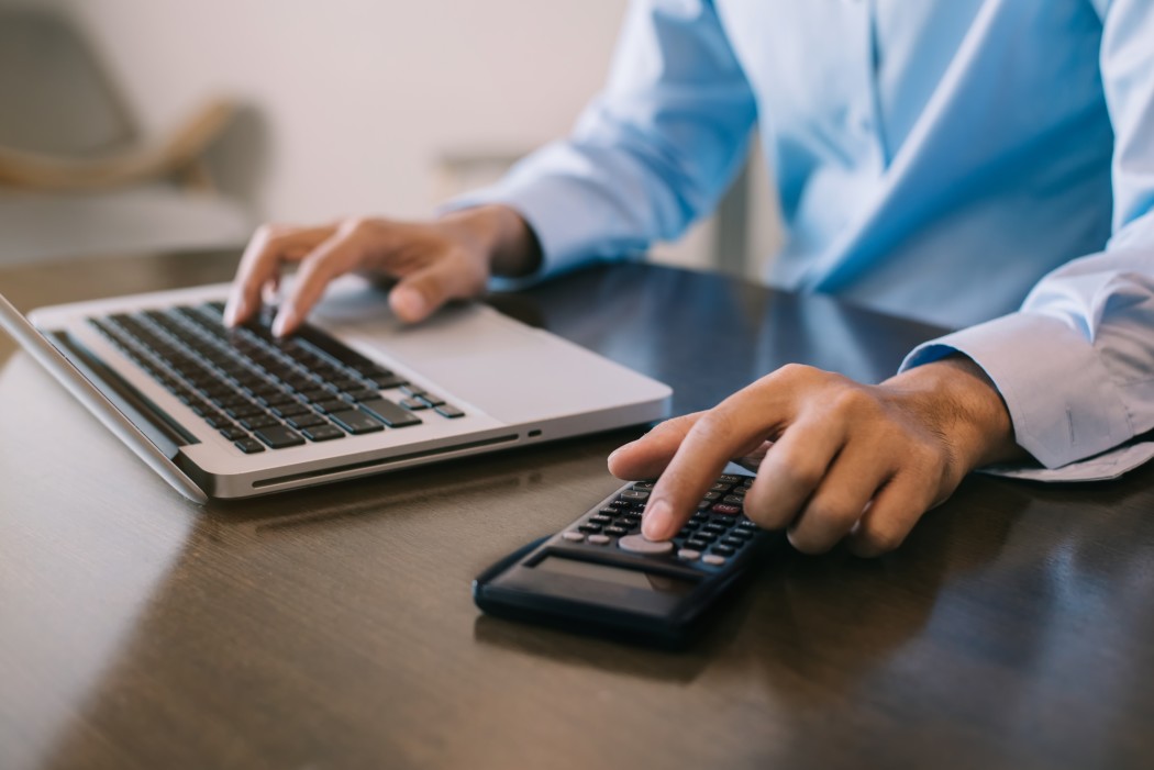 regulated accountant at desk